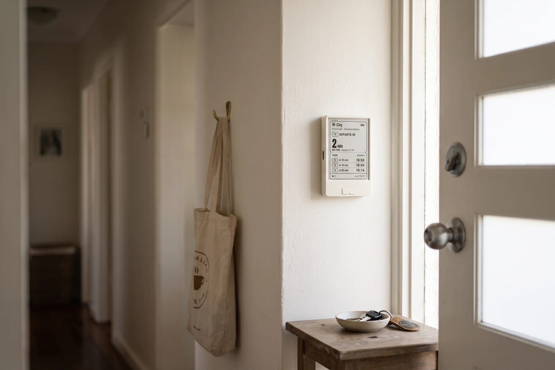 Get on board e-ink transit display mounted beside a home's front door